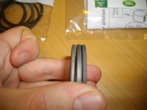 Comparison of brake caliper piston seal retainers